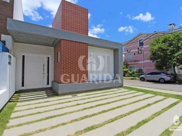 Casa com 3 quartos à venda na Rua Alexandre de Gusmão, 249, Hípica, Porto Alegre por R$ 578.000