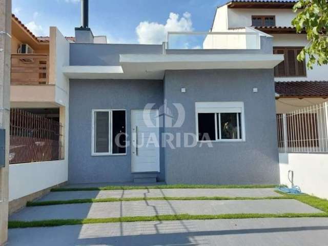 Casa com 2 quartos à venda na Rua Paulo Rogério Amoretty Souza, 40, Hípica, Porto Alegre por R$ 497.000