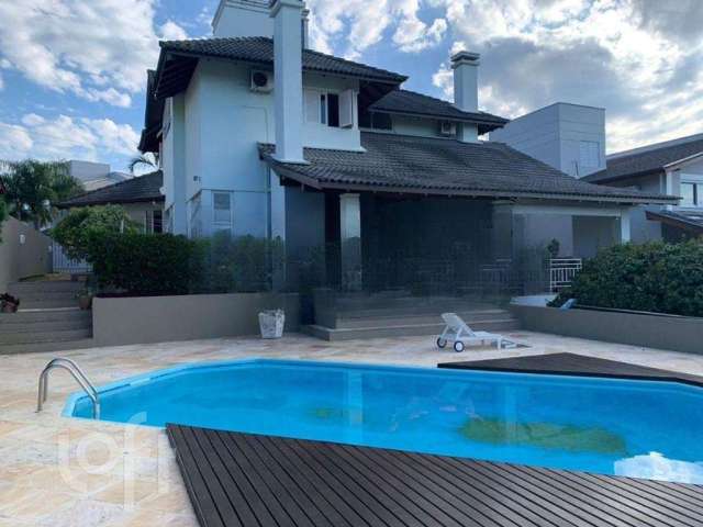 Casa em condomínio fechado com 3 quartos à venda na Rodovia Haroldo Soares Glavan, 3820, Cacupé, Florianópolis, 290 m2 por R$ 2.950.000