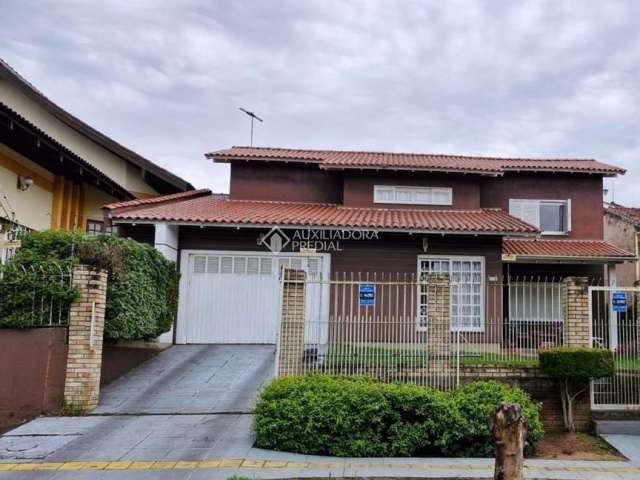 Casa com 4 quartos à venda na Rua Waldemar Guido Vicentini, 364, Dom Feliciano, Gravataí, 266 m2 por R$ 950.000