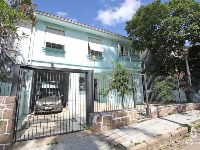Casa com 4 quartos à venda na Rua Xavier Ferreira, 113, Auxiliadora, Porto Alegre por R$ 1.000.000