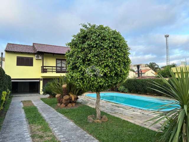 Casa à venda com 3 quartos/dormitórios, 5 vagas/box, no bairro Partenon, Porto Alegre.