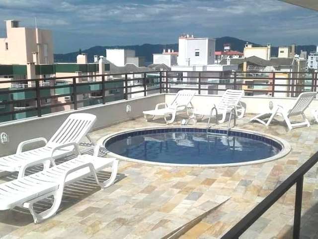 Apartamento em Canasvieiras: 2 Dormitórios, Mobiliado, Piscina com Vista para o Mar, Pé na Areia e Aceita Financiamento por R$ 680.000