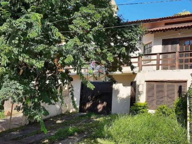 Casa com 3 quartos à venda na Avenida Doutor Francisco Roberto Dall Igna, 320, Espírito Santo, Porto Alegre por R$ 650.000