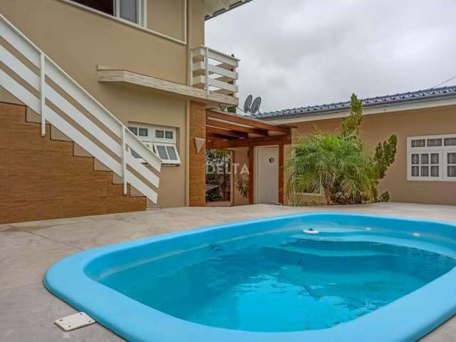 Casa à venda em Novo Hamburgo - Primavera, com churrasqueira, piscina e lareira