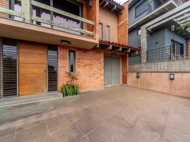 Casa com 3 quartos à venda na Rua Edgar Luiz Schneider, 490, Jardim Isabel, Porto Alegre por R$ 1.290.000