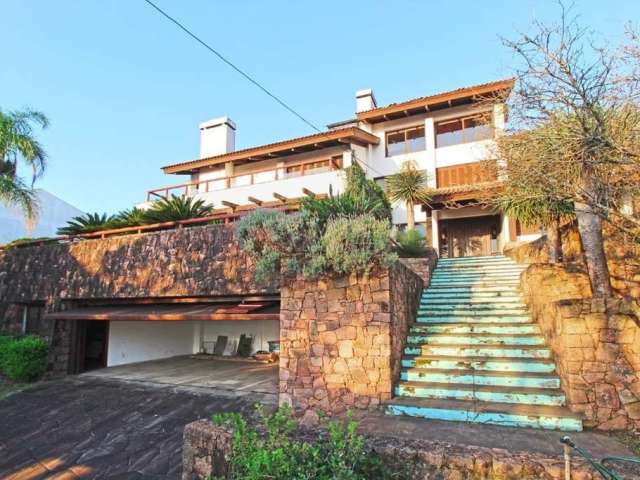 Casa com 4 quartos à venda na Rua Dona Lida Monteiro, 180, Teresópolis, Porto Alegre por R$ 1.300.000