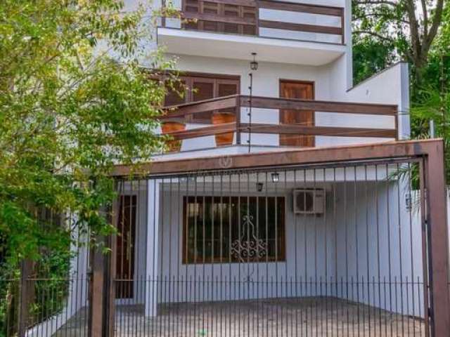 Casa com 3 quartos à venda na Rua Jayme Saul de Borba, 72, Espírito Santo, Porto Alegre por R$ 598.000