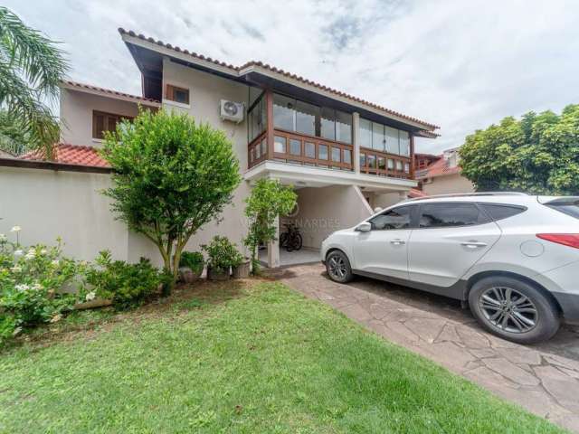 Casa em condomínio fechado com 3 quartos à venda na Avenida Eduardo Prado, 2050, Cavalhada, Porto Alegre por R$ 1.200.000