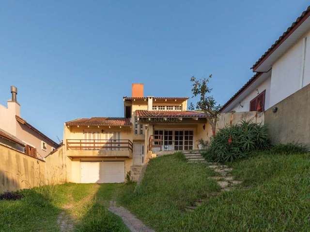 Casa com 3 quartos à venda na Rua Padre João Batista Reus, 2071, Camaquã, Porto Alegre por R$ 1.300.000