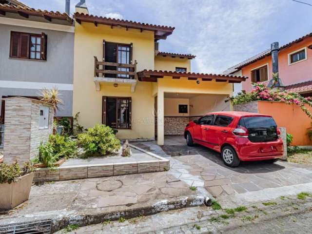 Casa em condomínio fechado com 3 quartos à venda na Rua Ponciano Pacheco da Silveira, 172, Guarujá, Porto Alegre por R$ 450.000