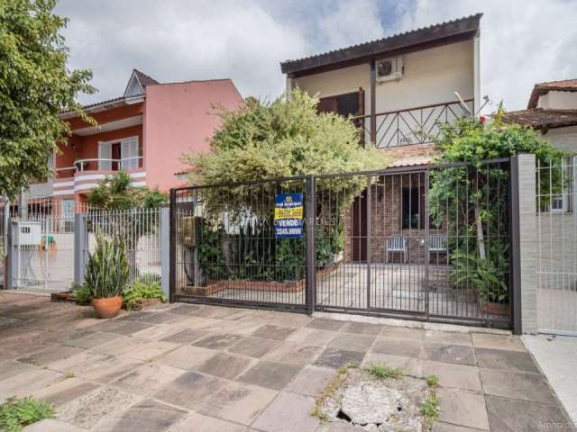 Casa com 3 quartos à venda na Rua Vacaria, 115, Hípica, Porto Alegre por R$ 480.000