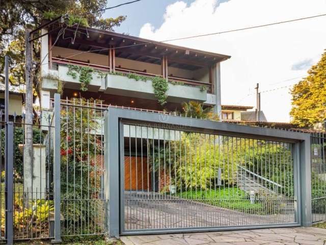 Casa com 4 quartos à venda na Rua Edgar Luiz Schneider, 460, Jardim Isabel, Porto Alegre por R$ 1.540.000