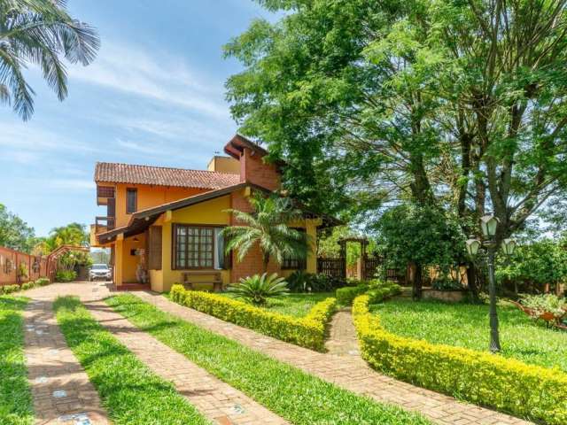 Casa com 4 quartos à venda na Estrada Costa Gama, 4730, Belém Velho, Porto Alegre por R$ 1.470.000