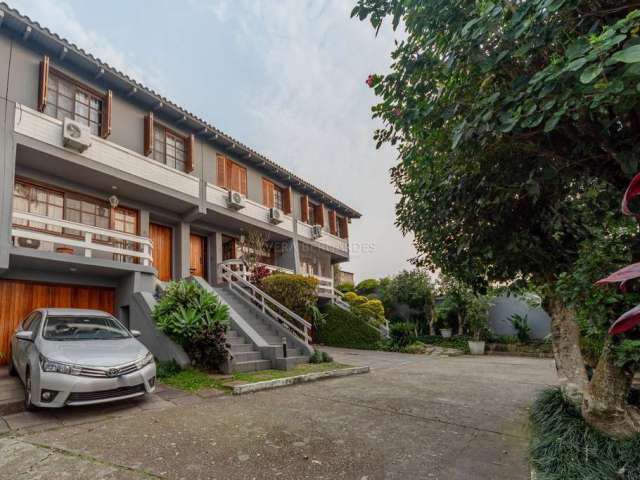 Casa em condomínio fechado com 3 quartos à venda na Rua General Rondon, 1259, Tristeza, Porto Alegre por R$ 1.050.000