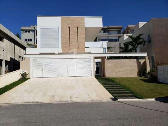 Casa para alugar com 417 m², 3 suítes, sala de estar, cozinha, 7 banheiros e garagem para 3 carros no Condomínio Villa Solaia