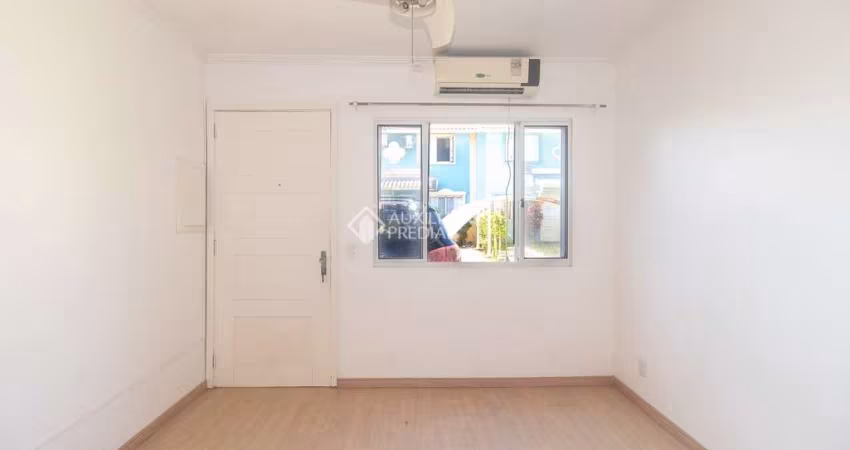 Casa em condomínio fechado com 2 quartos para alugar na Avenida José Aloísio Filho, 889, Humaitá, Porto Alegre