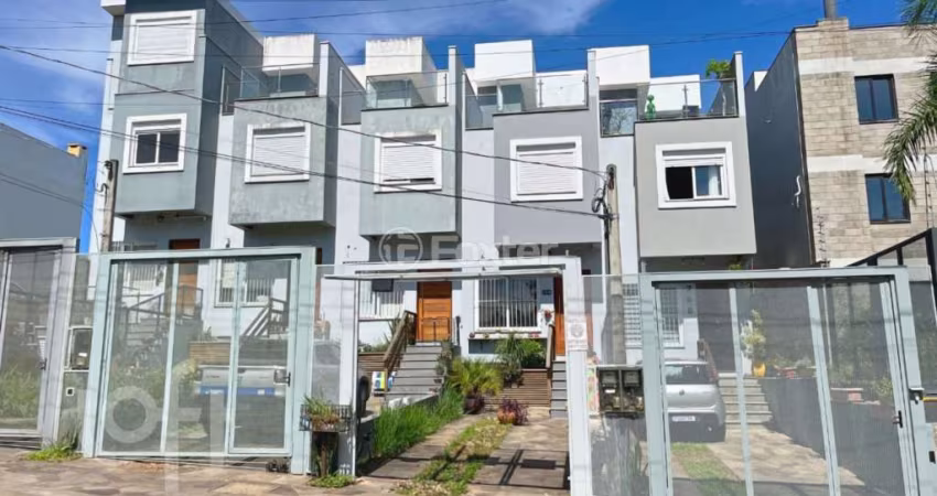 Casa com 3 quartos à venda na Rua Doutor Sérgio de Figueiredo, 284, Guarujá, Porto Alegre