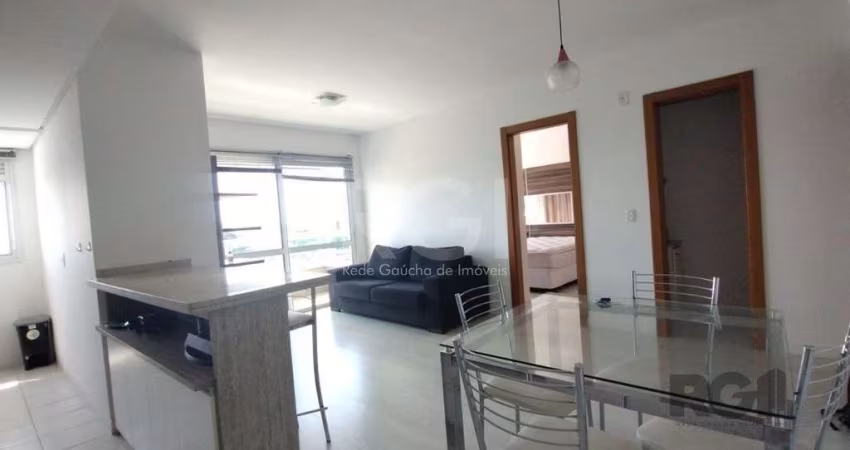 Apartamento mobiliado, 57m2, 1 suite, 1 vaga, lareira e churrasqueira, localizado no bairro Três Figueiras, Porto Alegre/RS.